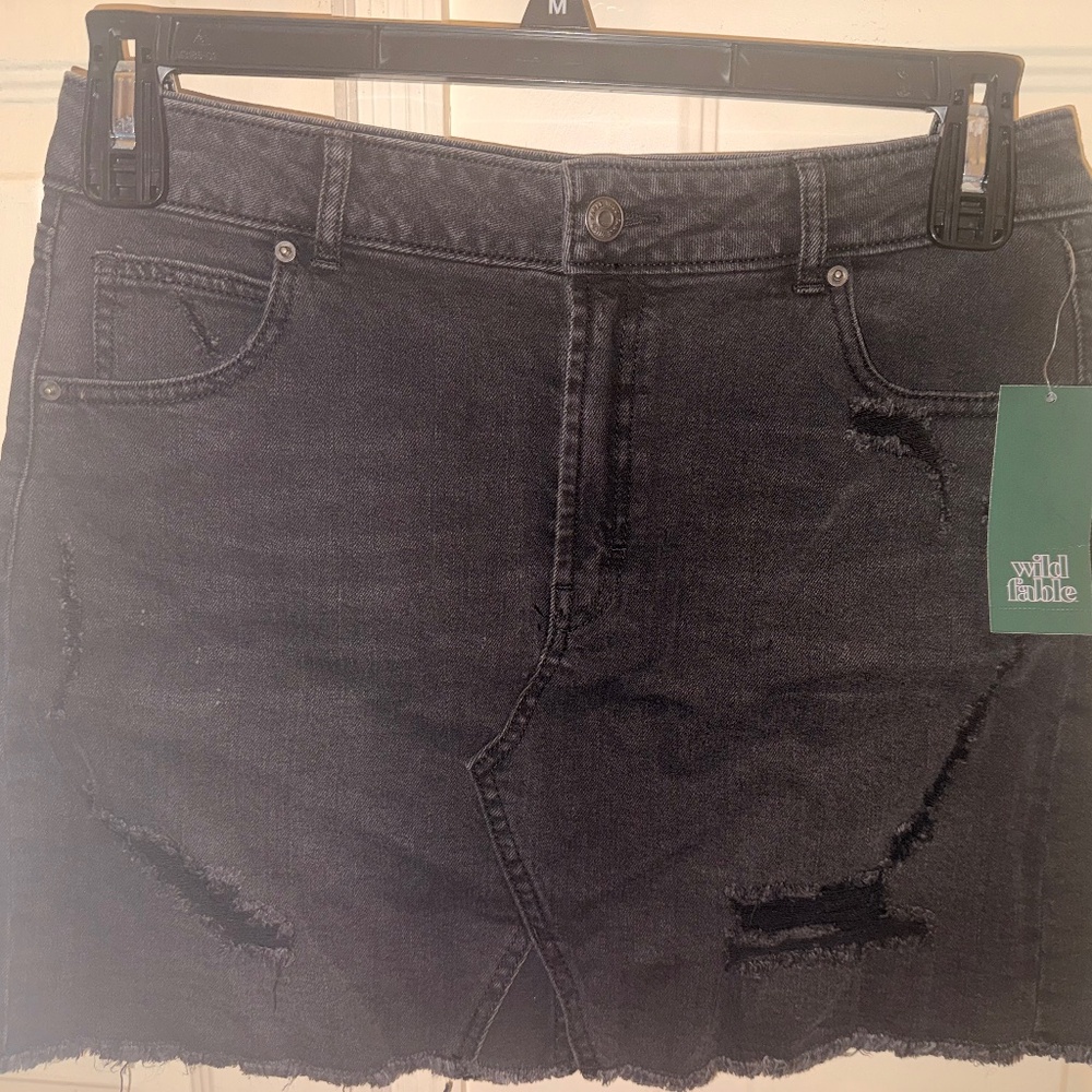 Distressed mini denim skirt